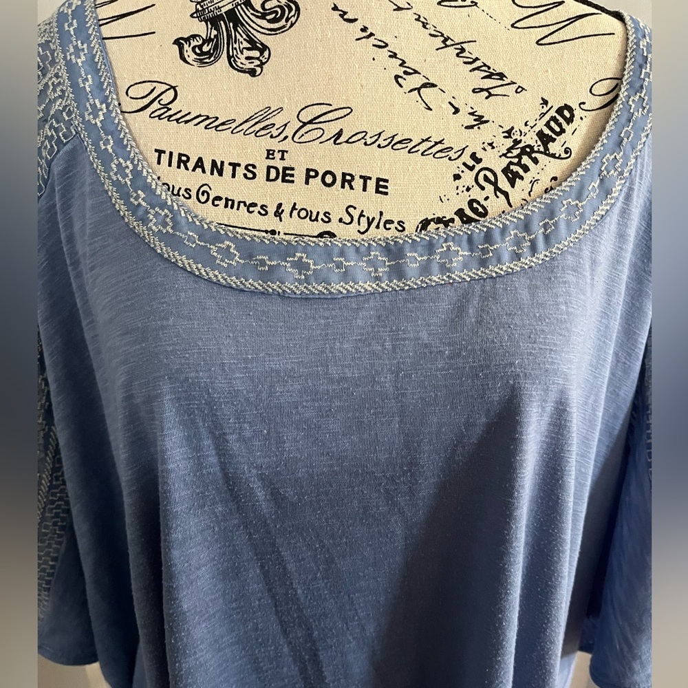 Beautiful light blue shirt with lace design on sleeves
